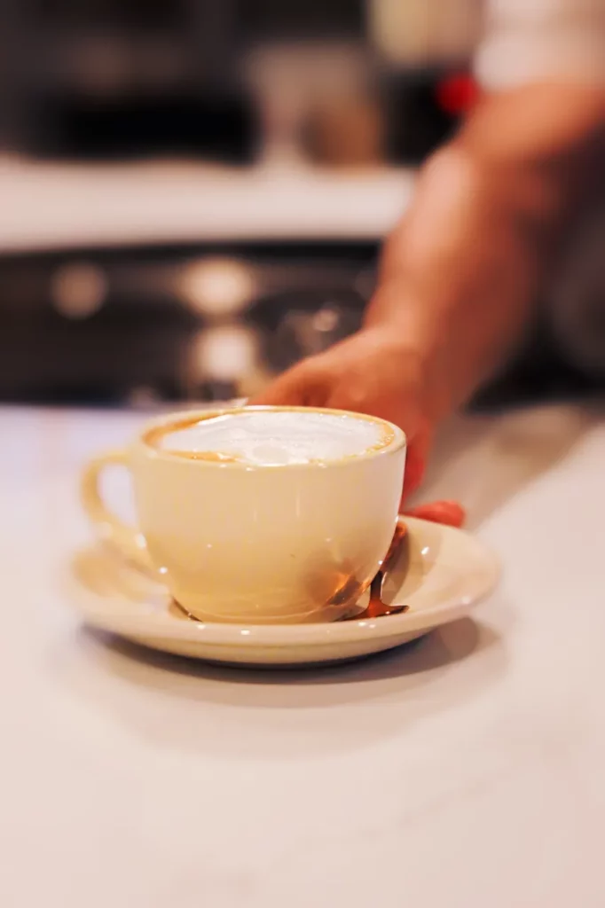 hand serving coffee
